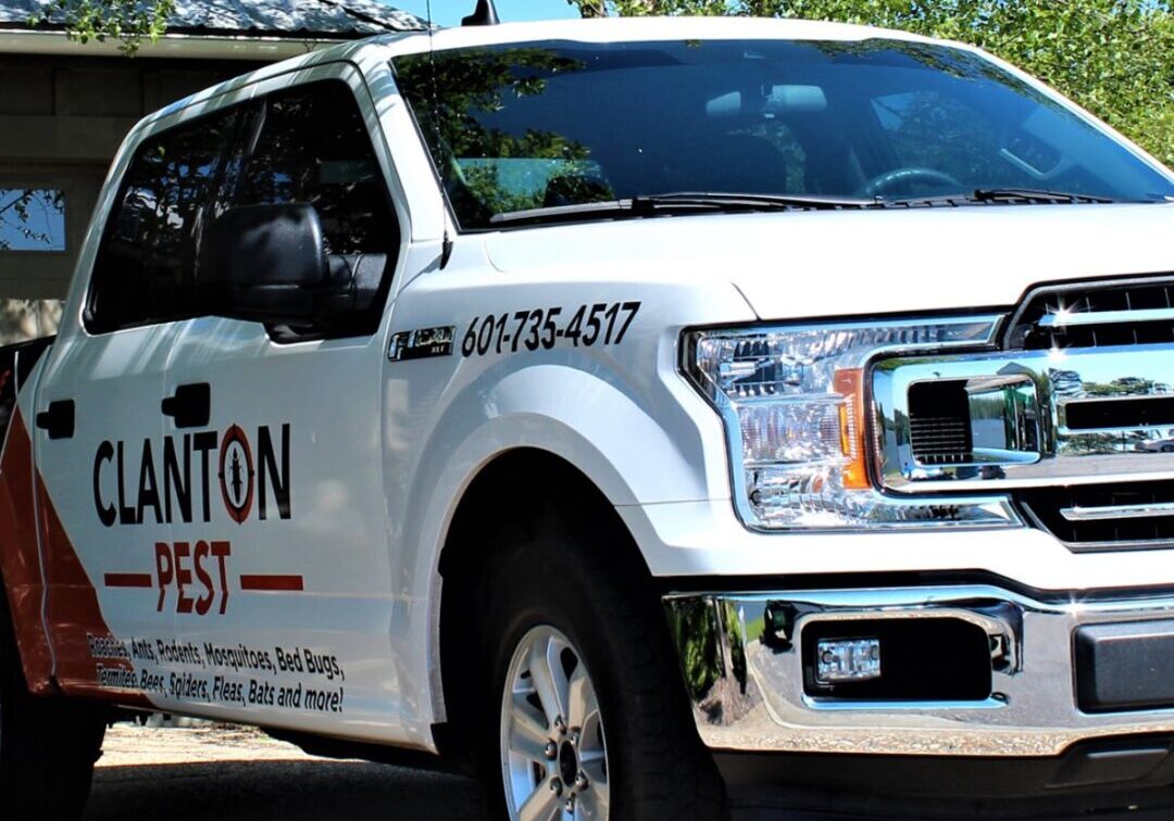 A white truck with the words " clanton fest ".